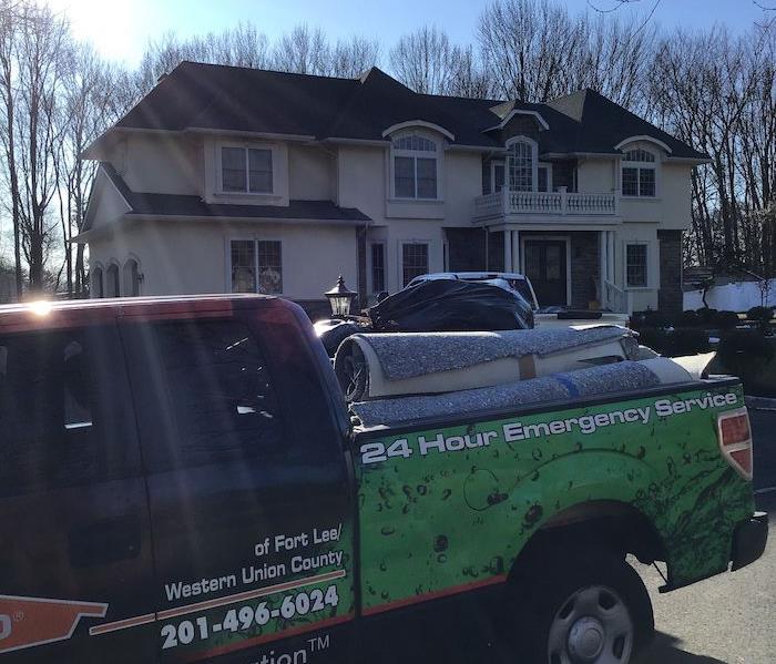 SERVPRO truck parked in front of home
