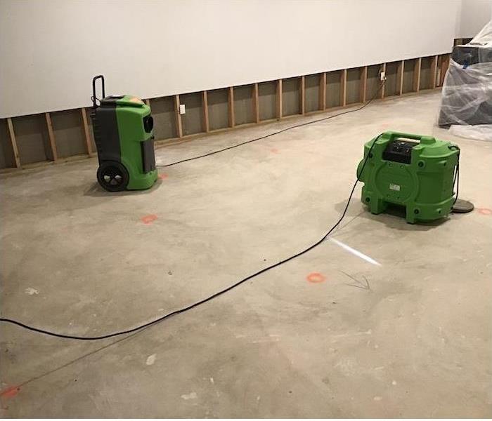 SERVPRO drying equipment on a water damaged floor
