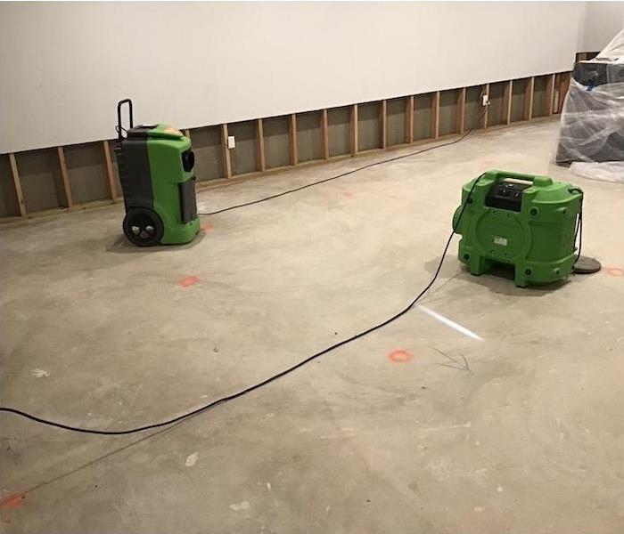 SERVPRO drying equipment on a water damaged floor