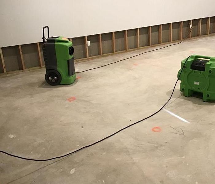 SERVPRO equipment on the floor of a home. 